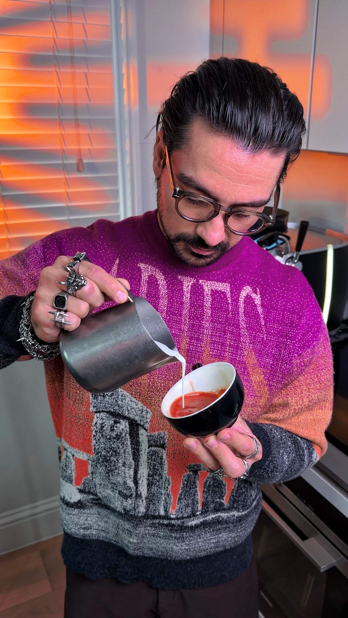 Abraham Akbareian pouring latte art